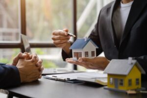 Considering buying a home, investing in real estate. Broker signs a sales agreement