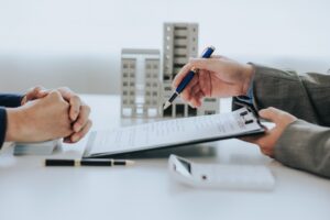  real estate agent offering a contract to purchase or rent a residence