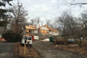 Distressed Property with Van in front
