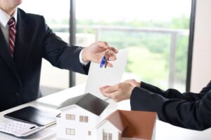 Image of handing over the keys to real estate